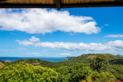 a view of the ocean from a hillside at Luxury Home with Views and Infinity Pool Near Beach! in Puerto Viejo