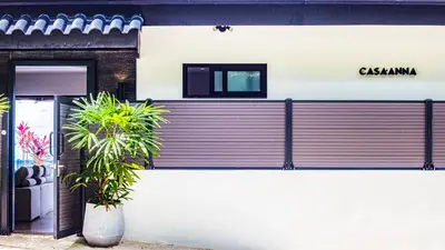 a building with a sign on the side of it at Casa Anna Santa Teresa in Santa Teresa Beach