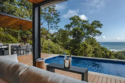 a villa with a view of the ocean at Le Suite in Santa Teresa Beach