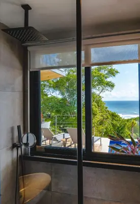 a view of the ocean from the living room of a house at Le Suite in Santa Teresa Beach