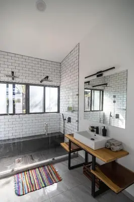 a bathroom with a sink and a mirror at Vista Loma Estate in San Isidro