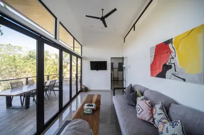 a living room with a couch and a table at Vista Loma Estate in San Isidro