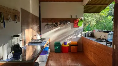 a kitchen with a counter and a sink and a stove at Playa Ganadito Ecolodge in Drake