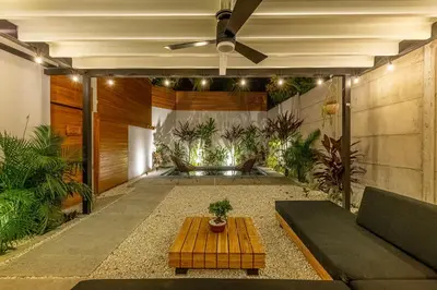 a living room with a couch and a table at Ventura Santa Teresa in Santa Teresa Beach