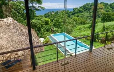 a view from the deck of a villa with a swimming pool at Casa Mirame in Carmen