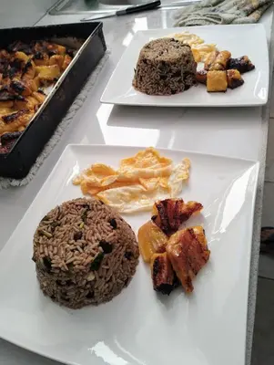 three white plates with different types of food on them at Casajungla Hostel in Jacó