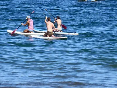 a group of people on kayaks in the water at Villa del Sueño in Playa Hermosa