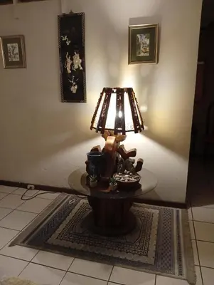 a lamp sitting on a table in a room at Confortable y privado estudio en zona exclusiva . in San José