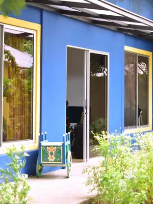 a blue house with a toy car in front of it at Guesthouse Congo Tempisque in Liberia