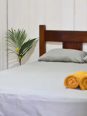 a close up of a bed with towels on it at Guesthouse Congo Tempisque in Liberia