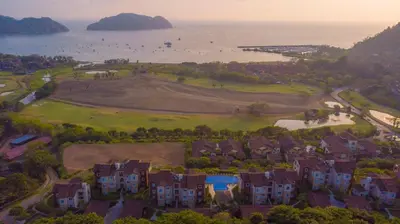 an aerial view of a house with a golf course at Miramar 4E 3 bdr Ocean View in Los Suenos in Herradura
