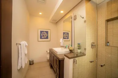 a bathroom with a sink and a shower at Miramar 4E 3 bdr Ocean View in Los Suenos in Herradura