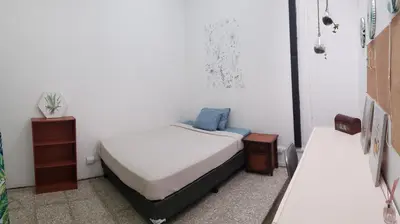 a bedroom with two beds in a room at Casa Mundo in San José
