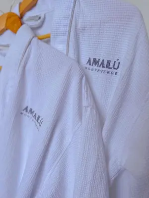 a close up of a white shirt with a orange tie at Amalú Luxury View Cabins in Monteverde Costa Rica