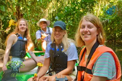 a group of women sitting together in the jungle at Casa Chilamates 2.0 in Tortuguero