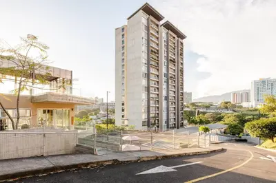 an empty street with a tall white building at New & Modern APT - 100 MBPS 15 min from airport in San José
