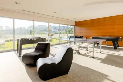 a room with a ping pong table and a pool table at New & Modern APT - 100 MBPS 15 min from airport in San José