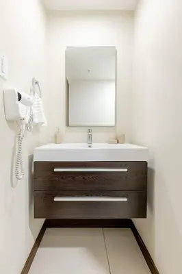 a bathroom with a sink and a mirror at New & Modern APT - 100 MBPS 15 min from airport in San José