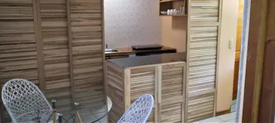 a kitchen with a desk and two chairs in a room at Space One in Manuel Antonio