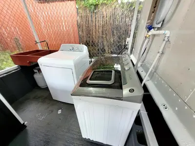 a washing machine sitting in the back of a truck at La Fonda Apartments in Fortuna