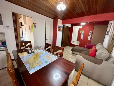 a living room with a table with a map on it at Apartment 10 minutes by the SJO airport - in Alajuela City
