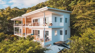 an aerial view of a house on a hill at Buena Vista Ocean View Apartments Santa Teresa in Santa Teresa Beach