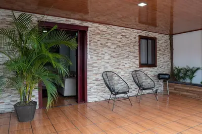 two chairs sitting on a patio with a plant at Tony's House in Fortuna
