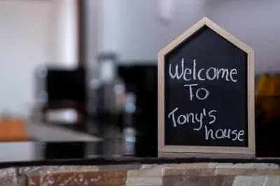 a sign that says welcome to harrys house at Tony's House in Fortuna
