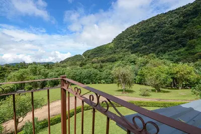 a balcony with a view of a mountain at Villa Golondrina Cabaña rodeada de Naturaleza in Monteverde Costa Rica