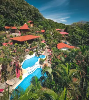 an aerial view of a resort with a pool at Hotel El Jardin in Montezuma
