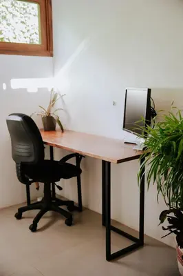 a wooden desk with a computer on top of it at Villa Fruta del Cielo in Uvita
