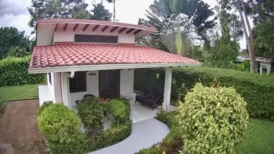 a small house with a red roof at Casa Hibiscus in Ojochal