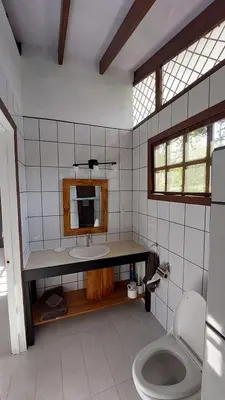 a bathroom with a sink and a toilet at Casa Hibiscus in Ojochal