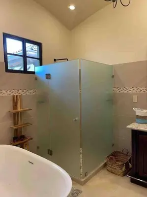 a bathroom with a shower and a bath tub at 3 Bedroom Villa in Hacienda Pinilla in Tamarindo