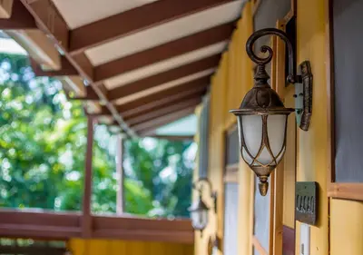 a lantern hanging on the side of a building at La Cusinga Lodge in Uvita