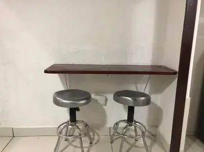 a table and two stools in a room at Pinky’s Place Airport, Full Equipment. in Alajuela City