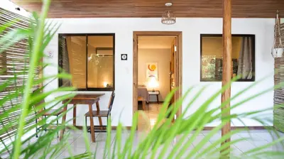 a room with a table and chairs in a house at GALA Santa Teresa Apartments 80m from the Beach in Santa Teresa Beach
