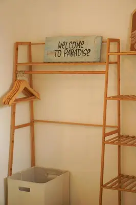 a room with two wooden shelves and a box at GALA Santa Teresa Apartments 80m from the Beach in Santa Teresa Beach