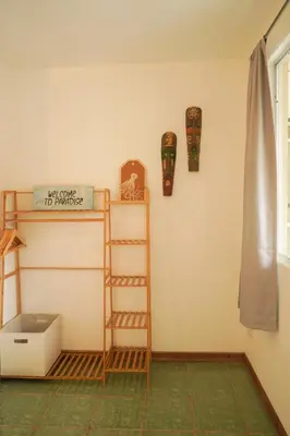 a room with a ladder and a shelf on a wall at GALA Santa Teresa Apartments 80m from the Beach in Santa Teresa Beach