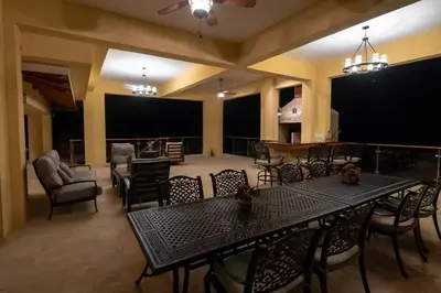 a large dining room with a table and chairs at Casa Amarillo Jaco Beach Costa Rica in Jacó