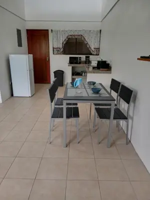 a kitchen and dining room with a table and chairs at KAPALIZ in Tigre