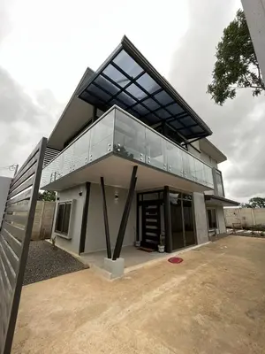 a modern house with a large glass roof at Brisas del Volcán BnB in Fortuna