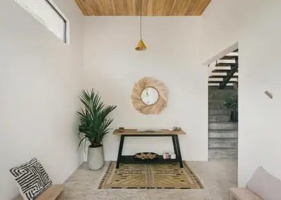 a room with a table and a mirror on the wall at Casa Arcilla NEW LISTING in Nosara