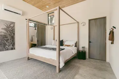 a bedroom with a canopy bed in a room at Casa Arcilla NEW LISTING in Nosara