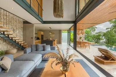 a living room with a couch and a table at Villa Lasai - Brand New Villa Luxury Villa in Carmen