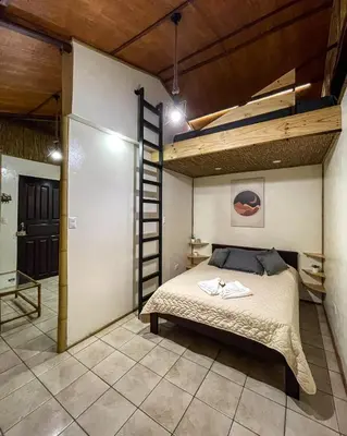 a bedroom with a bunk bed and a ladder at TERMINAL VERDE PRIVATE APARTMENTS NEAR AIRPORT 24h SELF CHECK IN in Concepción