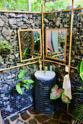 a bathroom with a sink and mirrors and plants at TERMINAL VERDE PRIVATE APARTMENTS NEAR AIRPORT 24h SELF CHECK IN in Concepción