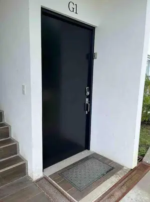 a black door with a sign on top of it at Lapa Lodge G1 in Jacó