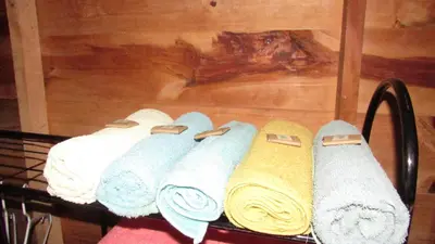 a rack of towels sitting on top of a table at Centro Ecológico Montaña Verde in Rivas