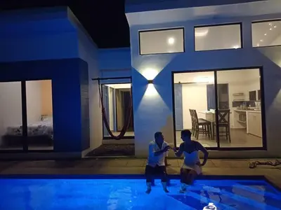 two men are fighting in a swimming pool at Loft 45 in Playa Hermosa, paradise near the ocean! in Playa Hermosa